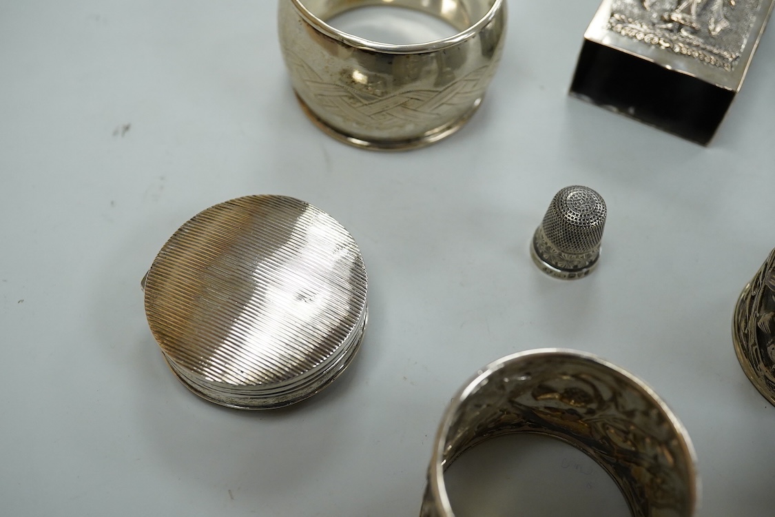 A collection silver and white metal to include a cased set of six George V seal top coffee spoons, Birmingham, 1927, a pair of Scottish napkin rings embossed with thistles, a pair of embossed heart shaped bonbon dishes,